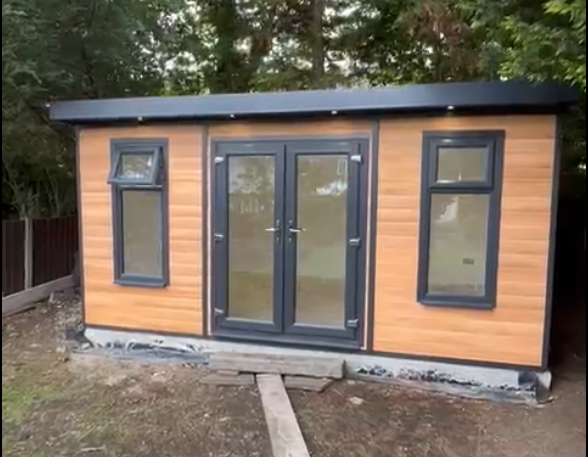 Anthracite uPVC colour option for cedar-colour composite garden rooms | Shed King